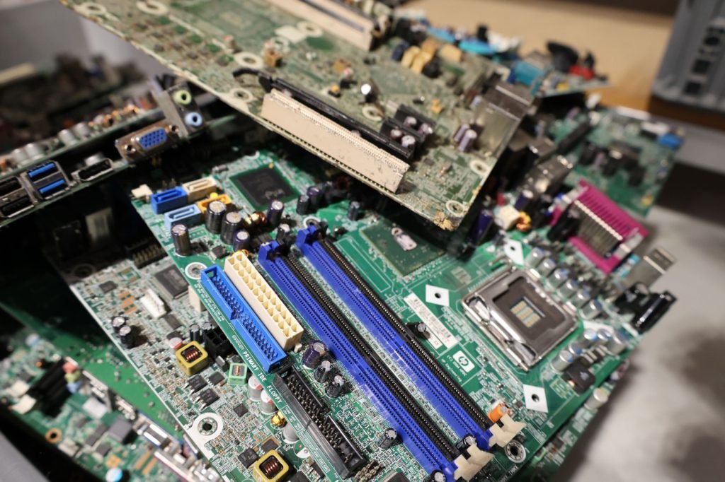 Loose logic boards stacked on top of one another after teardown
