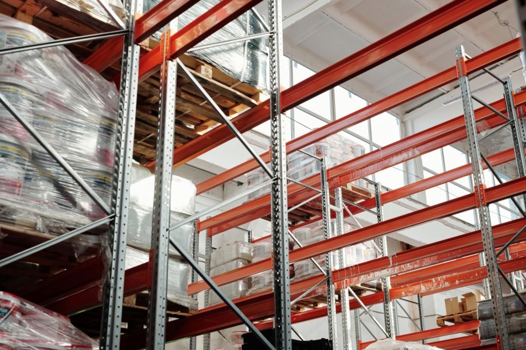 Wrapped pallets on steel racking inside a distribution warehouse